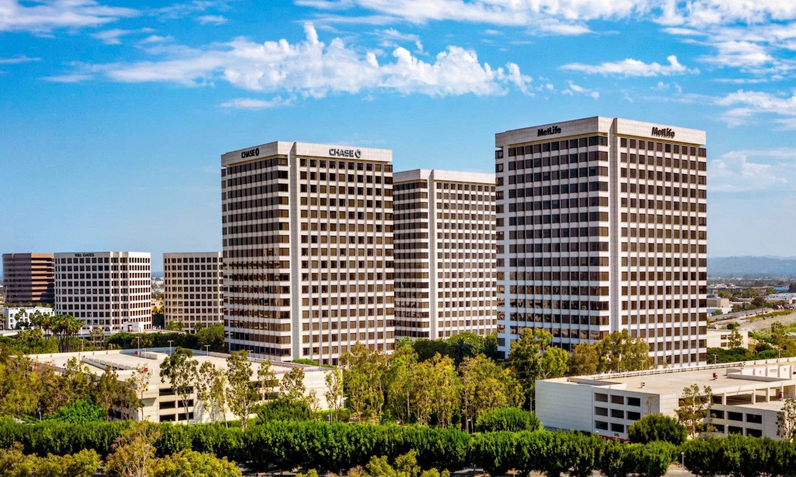 The Class A office campus above mature landscaping. Two 12-story towers totaling 600,000 square feet, known today as Centerview, at the institutional center of Orange County.