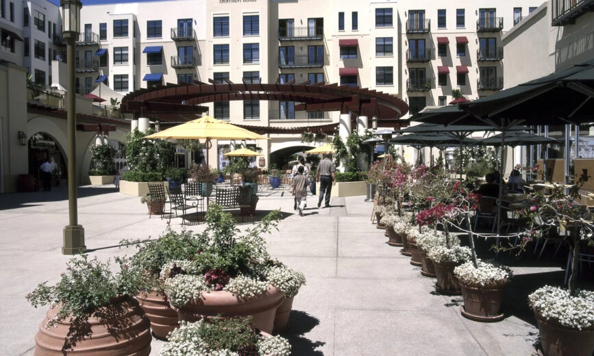 Paseo Colorado Pasadena. Open-air plaza with outdoor dining and residential above the retail. Southern California mixed-use retail developer.