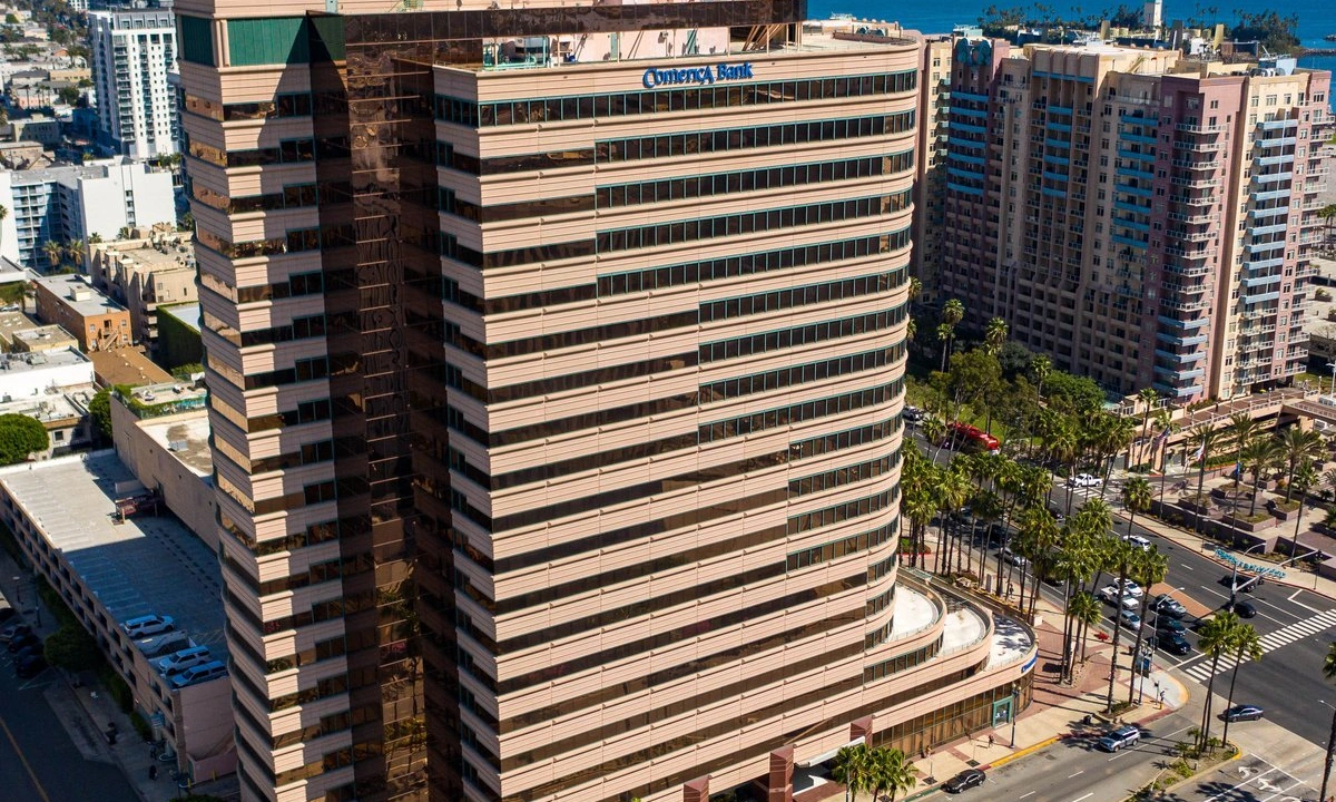 Shoreline Square Long Beach. Aerial view of the curved Class A office tower above the downtown waterfront and harbor. Long Beach commercial real estate.