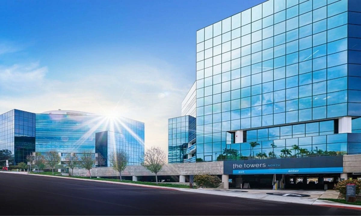 Sorrento Towers San Diego. The twin glass office towers with the entry drive and landscaping. San Diego Class A office development.